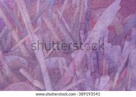 Old artists brushes for oil in vessels through soft violet shimmering Royalty-Free Stock Photo #389193541
