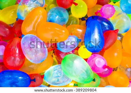 Many bright and colorful water balloons Royalty-Free Stock Photo #389209804