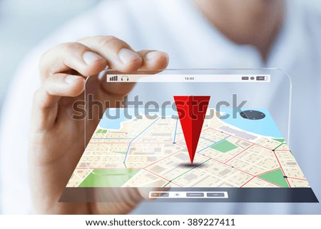 business, technology, navigation, location and people concept - close up of male hand holding and showing transparent smartphone with gps navigator map Royalty-Free Stock Photo #389227411