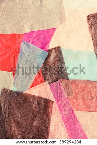 Pastel colored unusual background with wax papers stripes. Toned image.