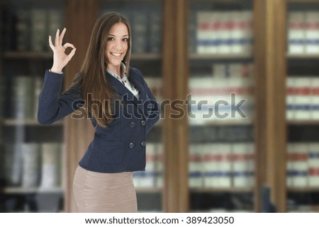 Business woman with expression library okay