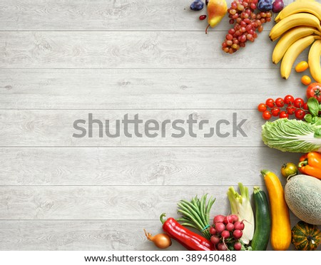 Healthy food background. Studio photo of different fruits and vegetables on white wooden table. High resolution product.