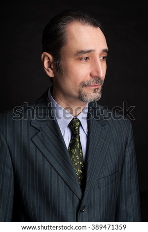 Closeup of a senior man isolated over black background