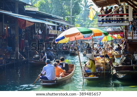Damnoen Saduak Floating Market, tourists visiting by boat, located in Bangkok, Thailand. Royalty-Free Stock Photo #389485657