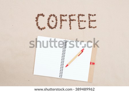 grain coffee and notebook on a brown table