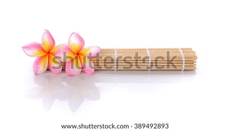 frangipani flower with bamboo on white background