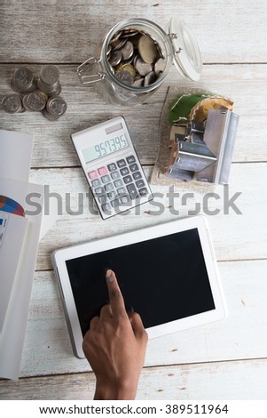 finance concept photo with coins and computer