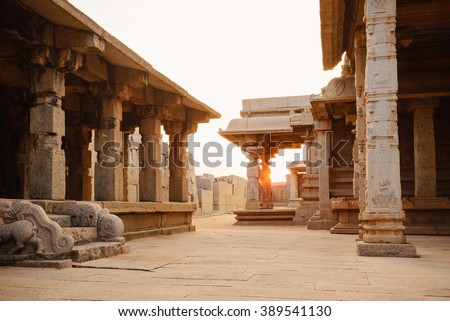 Beautiful columns architecture of ancient ruins of Hazara Rama temple in Hampi, Karnataka, India Royalty-Free Stock Photo #389541130