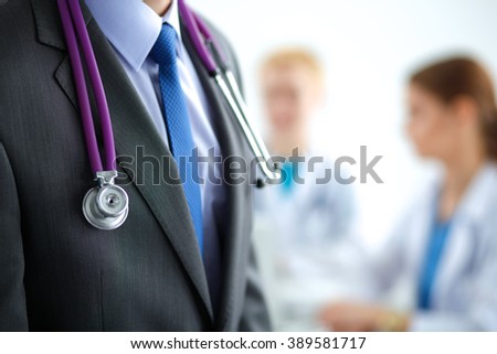 Male doctor in front of medical group