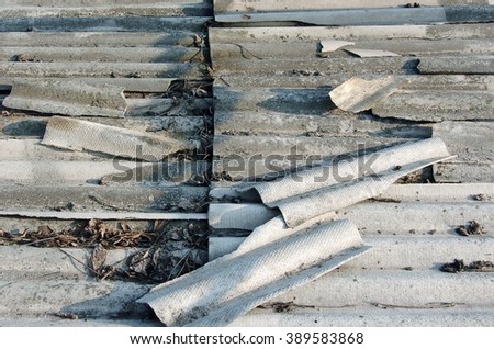 Asbestos roof background. Old grey roof tiles