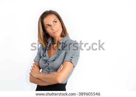 Young business woman looking up wondering. Isolated on white background. Copy space