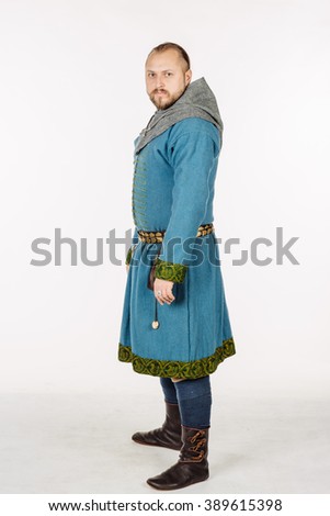 slavic soldier dressed in historical costume. image on white studio background. historical concept.