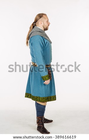 slavic soldier dressed in historical costume. image on white studio background. historical concept.
