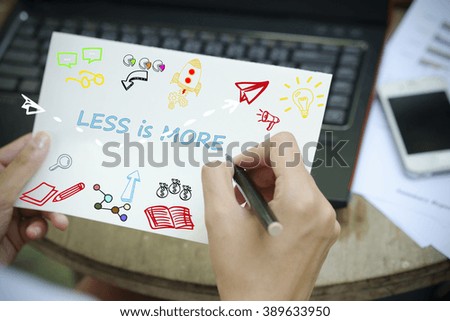 hand drawing  LESS IS MORE concept on white notebook , business concept , business idea , strategy concept , working at home concept