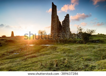 Sunset over the ruins of old tine mine engine houses on Bodmin Moor in Cornwall