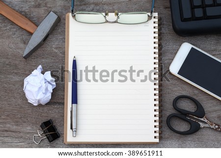 Pen and glasses on notebook