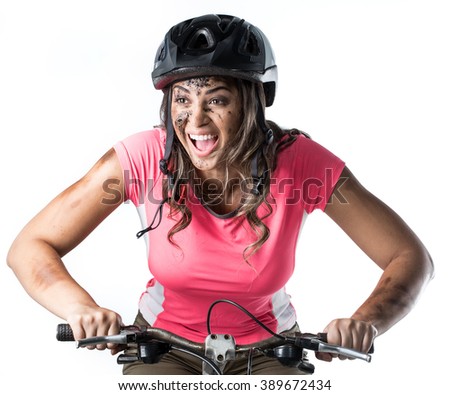 Woman covered in mud when riding a bike