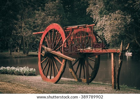 Red old cart, vintage background