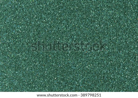 Green glitter background. Low contrast photo.