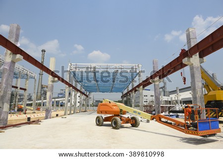 Steel structure roof truss under the construction building in the factory with blue sky