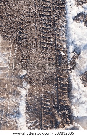 trace of cars on the dirt on the nature