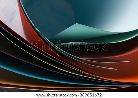 Abstract background.  Colorful curved sheets of paper.  Close-up shot