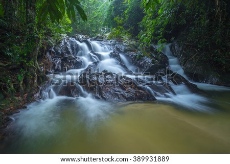 Long exposure of view hidden Templer Park's waterfall at Rawang, Selangor. Image contain excessively noise/sharp or blur due to long exposure. Royalty-Free Stock Photo #389931889