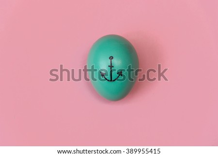 Flat lay stylish colored Easter egg with marker inscription