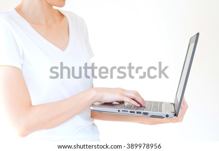 male hand holding a laptop, isolated on white