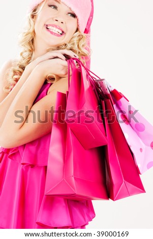 picture of cheerful santa helper girl with shopping bags