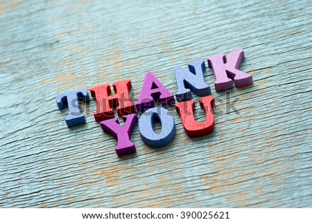 Thank you phrase made of wooden colorful letters on vintage background