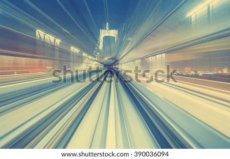 Abstract high speed technology POV motion blurred concept image from the Yuikamome monorail in Tokyo Japan