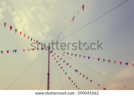 vintage tone image of festival triangle flag for background usage.
