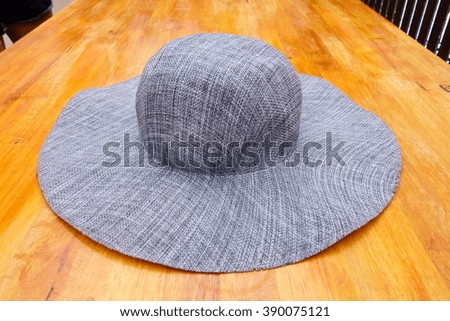 gray hat on wood table background