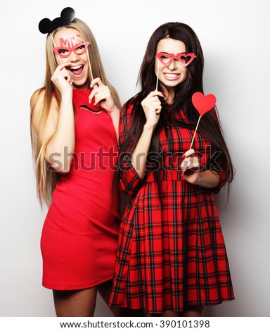  girls best friends wearing red dress  ready for party