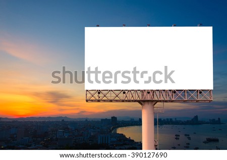 Blank billboard ready for advertisement in city downtown with sunrise background.