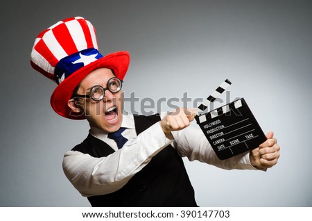Man with american hat and movie board