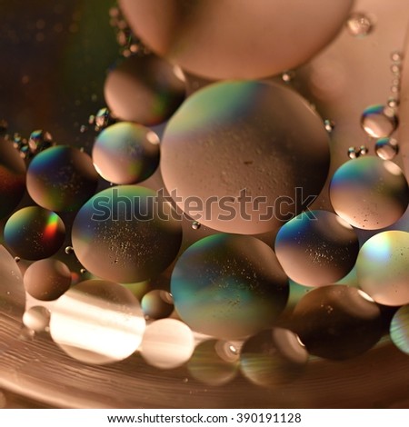 Oil drops on a water surface.
Beautiful colorful abstract background.