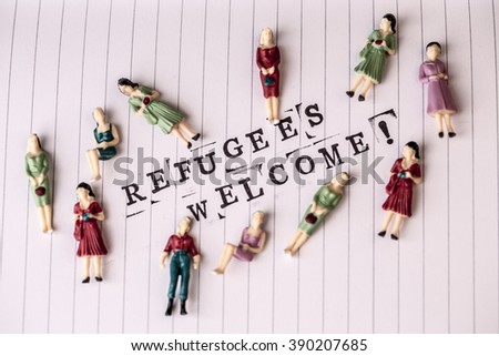 refugees welcome text on white line paper with woman figures around