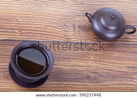 Chinese tea ceremony with ceramic set on wooden table