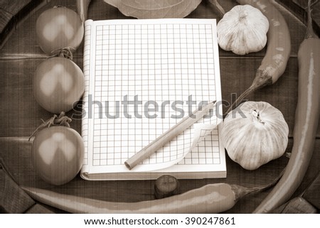 Notebook with recipes and shopping list in the kitchen. Old style. Sepia