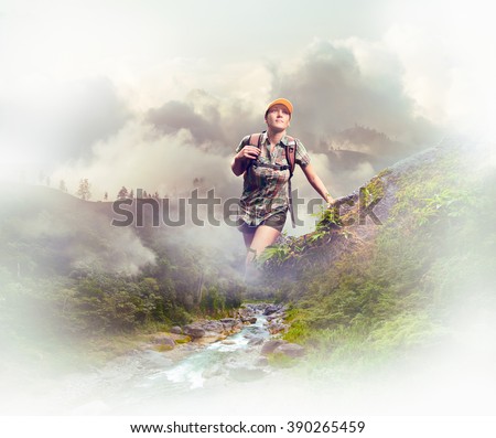 Young woman tourist with a backpack walking in the rain forest on background mountains. 
Concept eco tourism, hiking in the mountains.