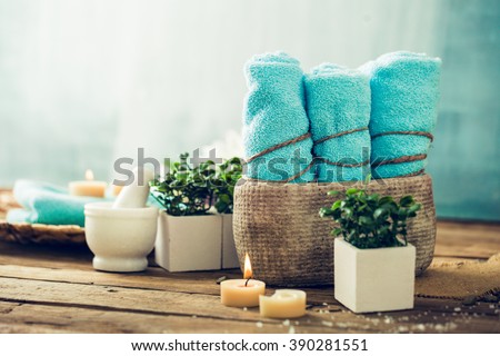 Spa and wellness setting with flowers and towels. Dayspa nature products Royalty-Free Stock Photo #390281551