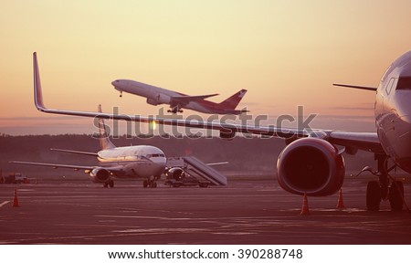 airport, the plane on takeoff, landscape Royalty-Free Stock Photo #390288748