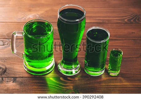  St. Patricks Day with a full glasses of beer on the wooden desk
