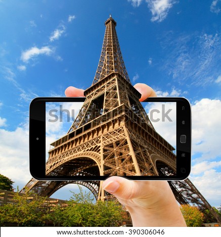 The Eiffel Tower in Paris during sunny day taken with a modern mobile phone