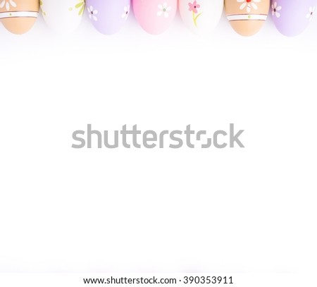Easter eggs painted in pastel colors on white background . Easter concept