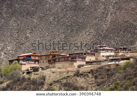 the tibetan temple and dwellings under blue sky with cloud.