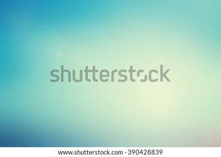 abstract blurred beauty teal color with flash aura and sparkle ray lens flare light effect for beauty background concept.vintage tone