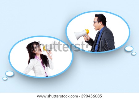 Picture of two businesspeople using megaphone to talk on the speech bubbles
